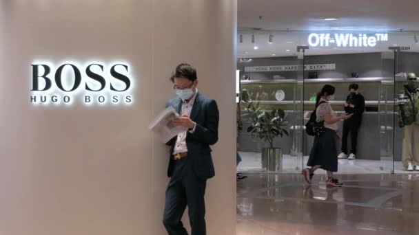 Shopper Stands Next German Clothing Brand Hugo Boss Store Shopping — Stock Video