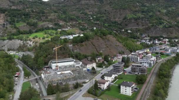 Rotating Aerial Shot Construction Going Small City Bitsch — Vídeos de Stock