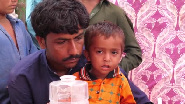 Father Young Child Waiting Flood Relief Camp Sindh Pakistan — Stock Video