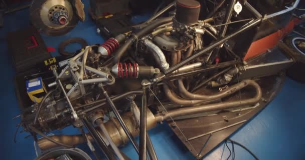 Engine Exhaust System Suspension Stripped Formula Garage Slow Camera Pan — Stock Video