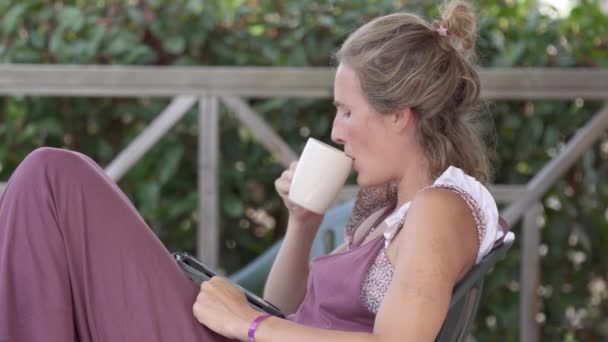 Woman Interrupted Her Cute Daughter She Having Cup Coffee Reading — Stock Video