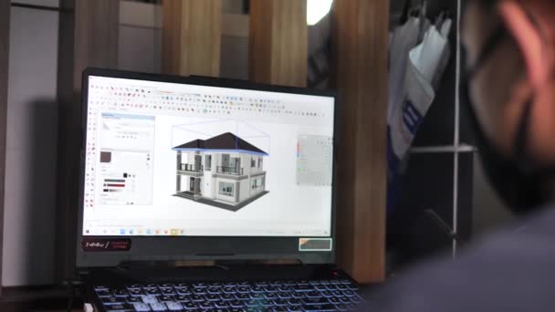 亚洲建筑师用电脑进行平面图的设计 — 图库视频影像