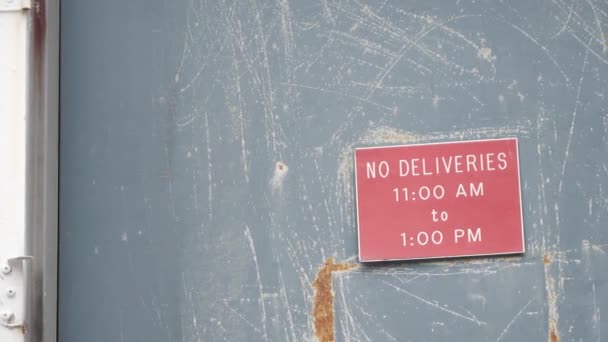 Lambat Motion Pan Creepy Red Deliveries Sign Abandoned Warehouse Door — Stok Video