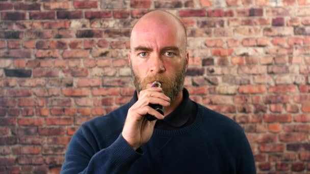 Portrait Man Vaping Indoors Front Brick Wall Cloud Smoke — Stock Video