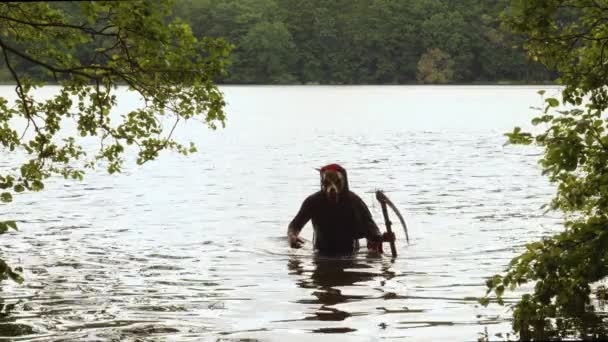 Grim Reaper Animal Skull Face Clutching Scythe Walking Out Water — Vídeos de Stock