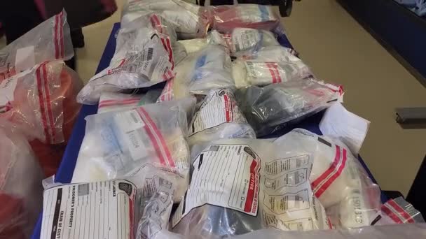 Close Dolly Shot Evidence Bags Containing Illegal Drugs Narcotics Taken — Stock video