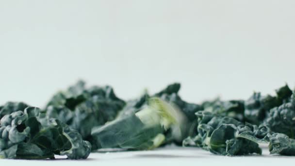 Handful Kale Leaves Fall Slow Motion White Tablecloth Natural Light — Stock Video