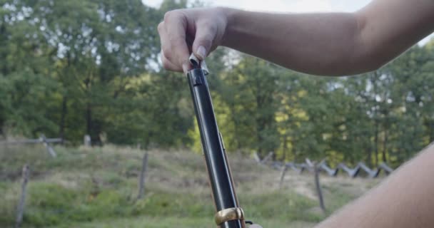 Person Sprinkles Gunpowder Barrel Musket — Stock Video