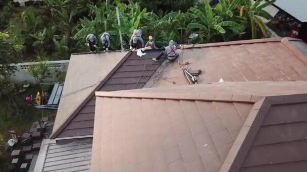 Asian Technician Work Roof Installation Aerial Shot — Stock Video