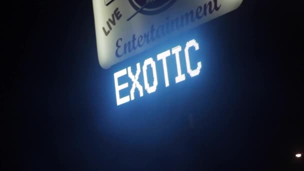 Hand Held Footage Bright Neon Sign Attracting People Stripclub — Stock Video