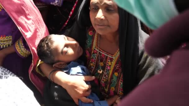 Mother Holding Disabled Child Flood Relief Camp Talking Aid Worker — Stock Video