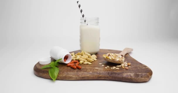 Pan Shot Cutting Board Basil Healthy Red Pills White Tablet — Stock Video