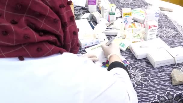 Shoulder View Female Doctor Writing Prescription Flood Relief Camp Sindh — Stock Video