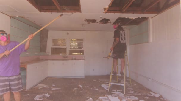 Static Shot Two Men Wearing Mask Face Repairing Collapsed Ceiling — Stock Video