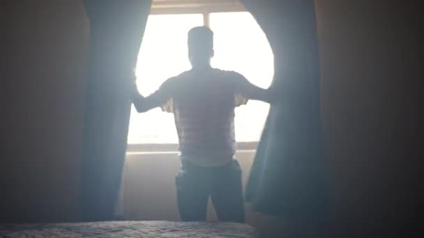 African American Man Opening Curtains Dark Room Morning — Stock Video