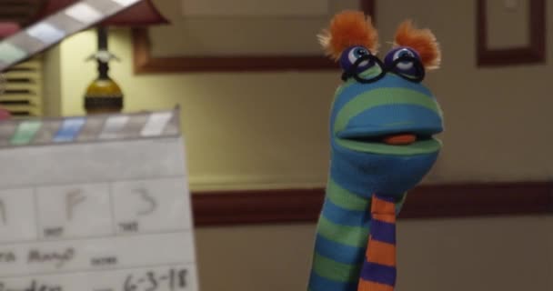 Funny Goofy Puppet Wearing Glasses Tie Movie Set Being Dramatic — Stock Video