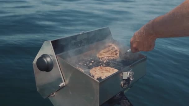 Man Grilling Boat While Enjoying Day Water — Stock Video