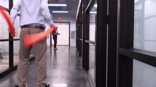 Fun Employee Having Fun Hoverboard Skiing Office Hallway — Stock Video