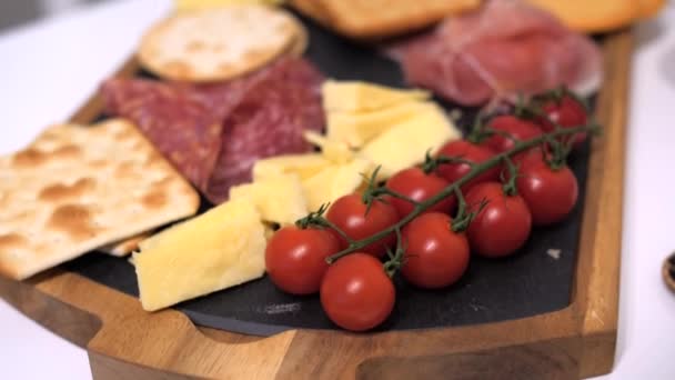 Starter Platter Cheese Crackers Salami Tomato Slow Hand Held Shot — Stock Video