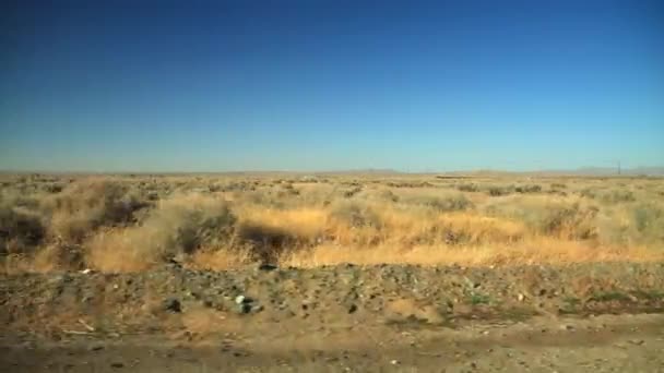 Driving Empty Desert Dry Plants Passing Side Road — Stock Video