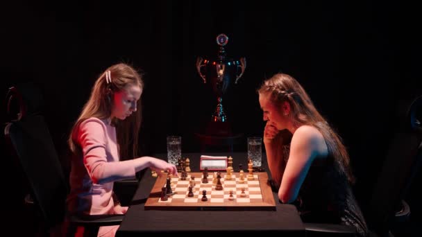 Two Ladies Playing Final Match Chess Tournament Trophy Dark Background — Stock Video