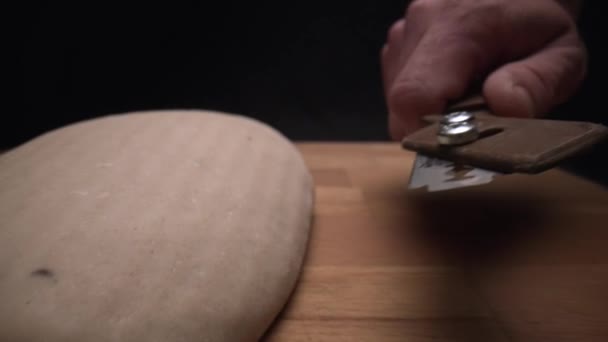 Macro Chef Cutting Freshly Kneaded Bread Razor — Stock Video