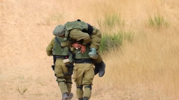 Combat Soldier Carries His Friend His Back Being Injured Runs — Stock Video