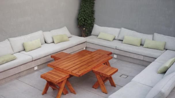 Aerial Pan Right Shot Decorated Outdoor Leisure Area Sofa Wooden — Stock Video