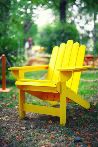 Yellow wooden chair on the grass — ストック写真