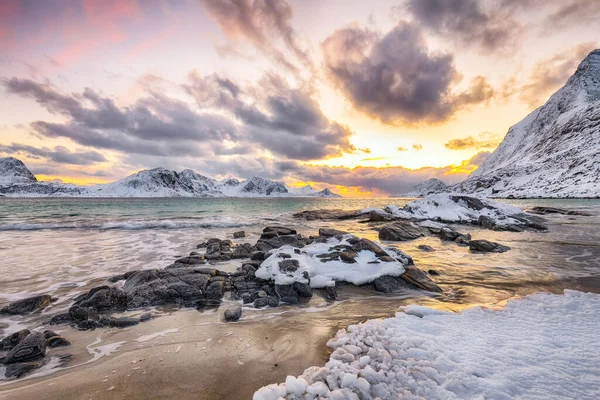 Amazing winter scenery with Haukland beach during sunset and snowy  mountain peaks near Leknes.  Location: Leknes, Vestvagoy, Lofotens, Norway