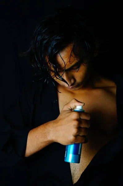Handsome young man using perfume , Men body spray , Vastav Kharat .
