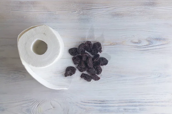 White Toilet Paper Black Dried Prunes White Wooden Background Copy — Stock Photo, Image