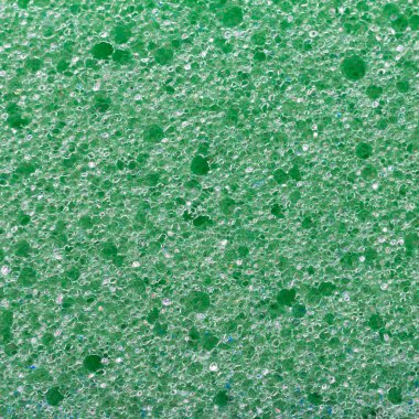 Yeşil sünger, yakın plan köpük malzemesinden yapılmış. Makro arkaplan.