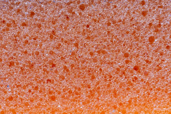Tekstura Pomarańczowej Gąbki Myjącej Zbliżeniu — Zdjęcie stockowe