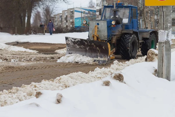 Snow removal from the streets with the help of special equipment in winter.