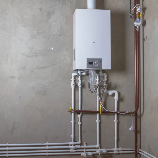 Doublecircuit gas boiler in a new house for winter heating and water heating. Stock Image