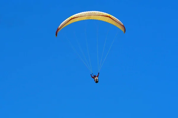 Athlete Flying Paraglider Yellow Paraglider Blue Sky Clear Sunny Summer Stock Picture