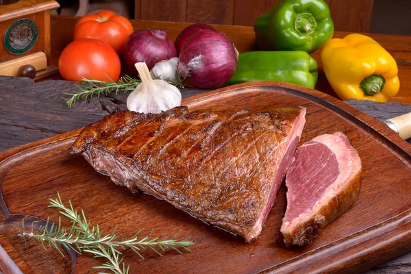 Roast picanha on wooden board — Stock Photo, Image