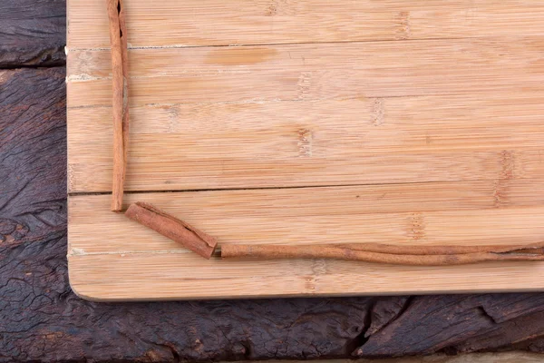 Cinnamon sticks on board — Stock Photo, Image