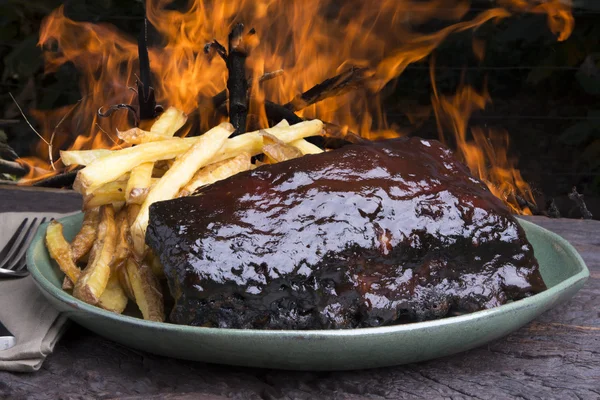 Pork ribs back with french fries — Stock Photo, Image