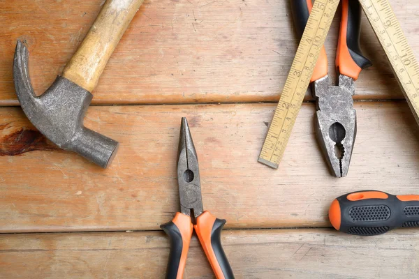 Hand Tools - Hammer, Phillips Screwdriver, Pliers and Wooden Met — Stock Photo, Image