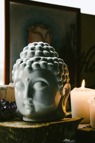 Spiritual ritual meditation face of Buddha ametist candles on old wooden background — Stock Photo, Image