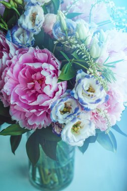 Beautiful bouquet of pink peonies, roses, eustoma flowers in vase on white window sill, cream color background. Spring or summer lovely . Fresh floral, home decor. Pastel colors purple, green. Place clipart