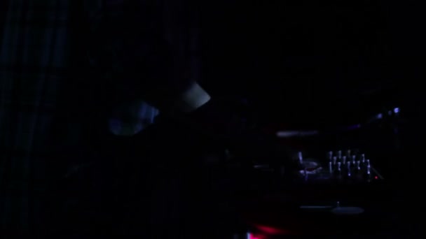 Dj Scratching Vinyl Records And Mixing On The Decks At A Disco In