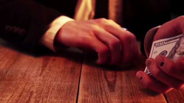 A craps player is shaking hand and throwing dices a lot of times in order to get the biggest number — Vídeo de Stock