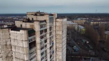 Closeup aerial view of high apartment building situated in bedroom community