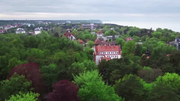 Aerial drone footage of the old town with situated on a shoreline on the cliff — Stock Video