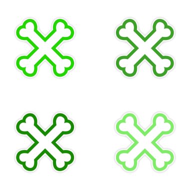 derleme etiket beyaz bir arka plan üzerinde yığılmış kemikleri çapraz