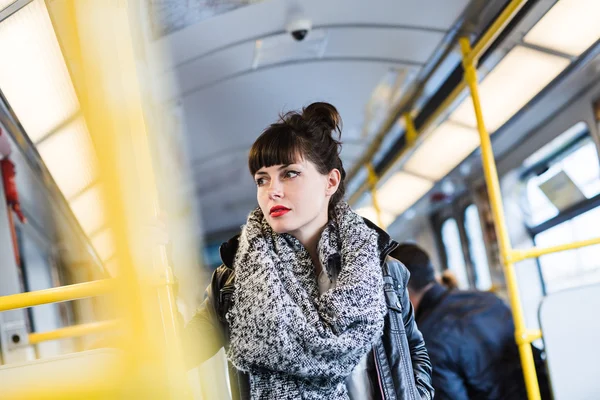 Young woman standing in train — Stock Photo, Image