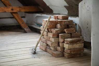 Bricks and  hammer in house clipart